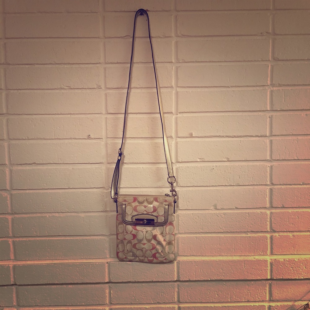 Pink, silver, and white Coach crossbody